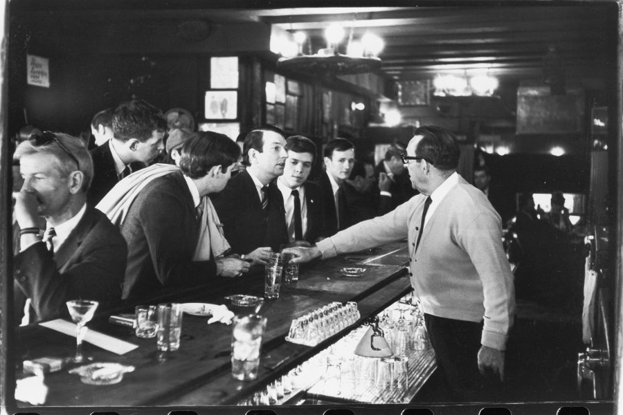 (Left to right) Mattachine Society members John Timmons, Dick Leitsch, Craig Rodwell, and Randy Wicker being refused service by the bartender at Julius', April 21, 1966 Gift of The Estate of Fred W. McDarrah.