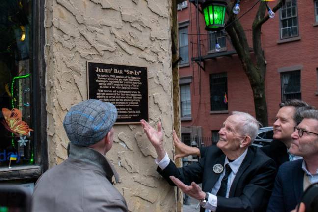In front of Julius’, (from left to right) on April 21, 2022: Andrew Berman, Randy Wicker, Sen. Brad Hoylman, and Ken Lustbader look up at the new plaque, cementing the location in history. Photo: Leah Foreman